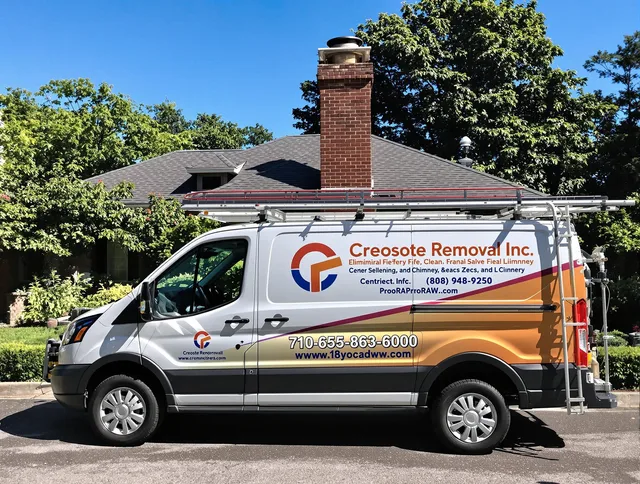 Westport Chimney Sweep technician removing creosote safely in Westport, MA
