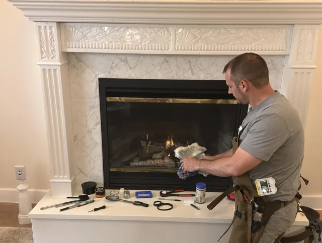 Westport Chimney Sweep performing fireplace maintenance in Westport, MA