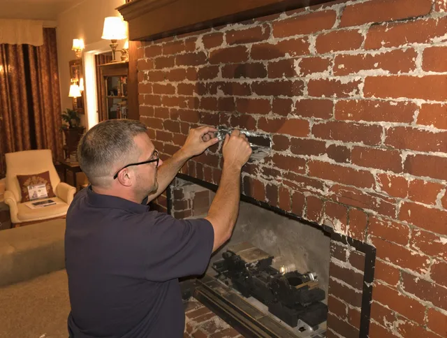 Westport Chimney Sweep expert fixing a fireplace in Westport, MA